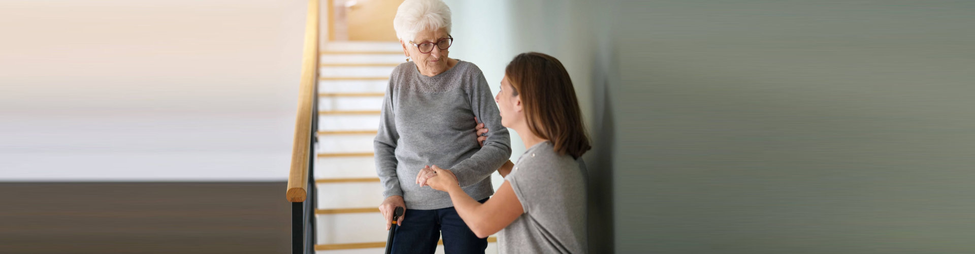 caregiver assissting senior woman