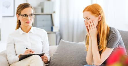 therapist listening to woman